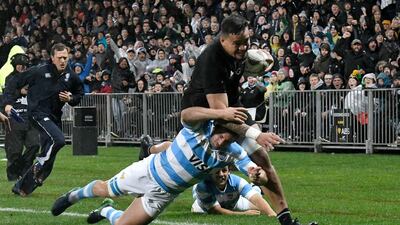 New Zealand's Vaea Fifita, right, runs in a try as he is tackled by Argentina's Santiago Cordero. Marty Melville / AFP
