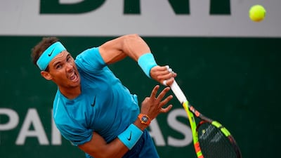 Spain's Rafael Nadal serves to Argentina's Guido Pella during their men's singles second round match. Eric Feferberg / AFP