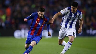 Barcelona's Lionel Messi, left, duels with Real Sociedad's Yuri Berchiche during a Primera Liga match in Barcelona on April 15, 2017. Manu Fernandez / AP Photo