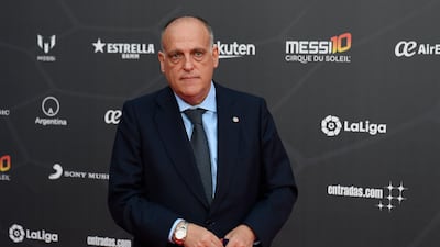 The president of Spanish Liga Javier Tebas poses on the red carpet. AFP