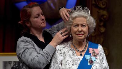 Madame Tussauds refreshes its Queen Elizabeth II wax figure with a recreation of the longest reigning monarch’s diamond jubilee dress at Madame Tussauds on September 7, 2015 in London, England. The wax figure was updated after Buckingham Palace announced that on September 9, 2015 Queen Elizabeth II would surpass Queen Victoria as the longest reigning monarch. Ben Pruchnie / Getty Images