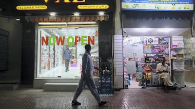 Neon signs light up the Creek area of Dubai at night. Chris Whiteoak / The National