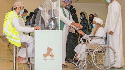 People register to be immunised against Covid-19 at Oman Convention & Exhibition Centre in Muscat. Elderly people and those with chronic illnesses can now be vaccinated at home, Oman’s health minister said on Sunday. AFP