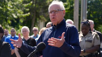 Minnesota Governor Tim Walz speaks after the shooting. AP