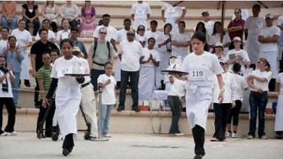 Waiters and waitresses from across Abu Dhabi showed a friendly rivalry as they went head-to-head at Khalifa Park.