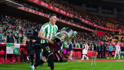 Joaquin runs on to the pitch with the Copa del Rey trophy. Getty