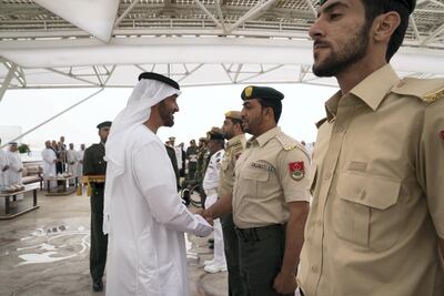 Sheikh Mohammed bin Zayed, awards a member of the UAE Armed Forces with a Medal of Bravery for his service in Yemen. Mohammed Al Hammadi / Crown Prince Court.