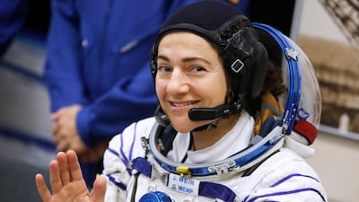 Jessica Meir waves prior the launch of Soyuz MS-15 space ship. Dmitri Lovetsky / AP