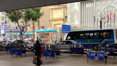 Chairs and tables ready to be set up for iftar under a bridge on 26th of July street in Zamalek