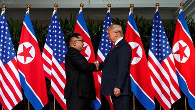 North Korean leader Kim Jong Un and US President Donald Trump in 2018 shake hands prior to their meeting on Sentosa Island in Singapore. AP