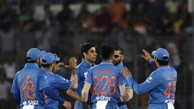 Ashish Nehra, centre, has been on the Indian selectors' radar for the past 18 years. Munir uz Zaman / AFP