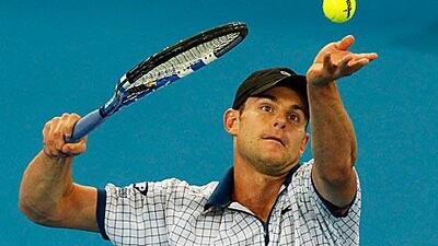 Roddick throws the ball up to unleash a serve during his semi-final victory.