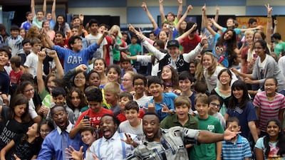 Students at the American Community School of Abu Dhabi were treated with a visit by Kofi Kingston (from left), Xavior Woods and Big E as part of the “Be a Star” campaign, co-founded by the WWE. Delores Johnson / The National