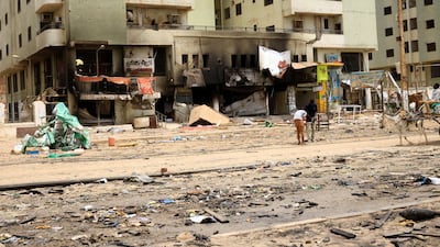 Workers fix power lines after clashes between the Rapid Support Forces and Sudan's army, in Khartoum, on Thursday. Reuters
