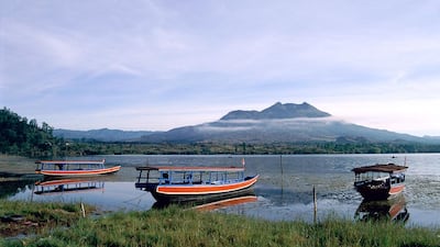 Cycle down the path cutting through the Gunur Batur volcano in Bali’s central mountainous area. iStock