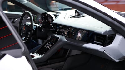 Touchscreen dashboard monitors sit inside the all electric Porsche AG Taycan luxury automobile. Bloomberg