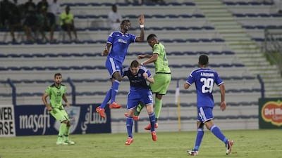 Ibrahima Toure, in blue, wins an aerial ball duel against Renan Garcia during the semi-final, first leg of the GCC Clubs Championships. Sarah Dea / The National