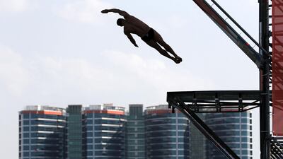 Divers warm up before the final of the mens section at the Fina High Board Diving World Cup.