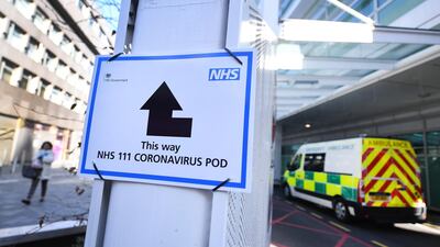 A sign indicates directions to a Coronavirus pod at a hospital in London; British Prime Minister Boris Johnson has announced that Britons can only leave their homes for essential reasons or may be fined, in order to reduce the spread of the Coronavirus EPA
