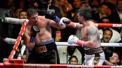 Ukraine's Oleksandr Usyk throws a flurry of punches at Netherlands' Rico Verhoeven forcing the referee to stop the bout. AFP