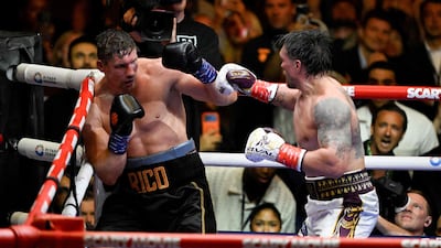 Ukraine's Oleksandr Usyk throws a flurry of punches at Netherlands' Rico Verhoeven forcing the referee to stop the bout. AFP