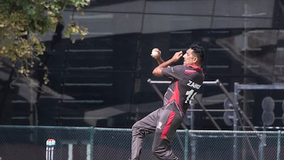 Zahoor Khan bowls for the UAE during the Cricket World Cup League 2 match against Oman at the ICC Academy in Dubai.