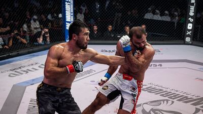 Shakhmar Sadygov, left, lands a punch on Jakhongir Jumaev in the UAE Warriors 54 at the Abu Dhabi National Exhibition Centre on Saturday, September 28, 2024. Photos: UAE Warriors