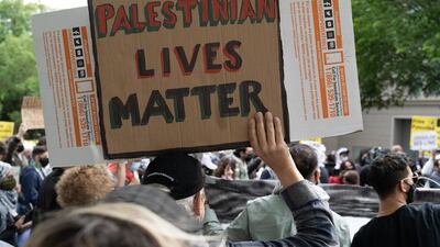 A demonstrator holds a Palestinian Lives Matter sign outside the US State Department in Washington on May 11, 2021. Willy Lowry / The National