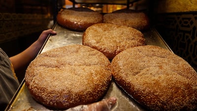 Traditional sweet bread, known as maarook, which is popular during the holy month, being prepared at a Syrian bakery in Midan, Damascus. AFP