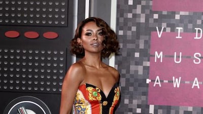 Vampire diaries star Kat Graham shone in Versace. Paul Black / EPA