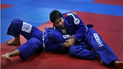 Yahya Mansour Al Hammadi, right, is a two-time world champion (2009 and 2010) whose tactic is to get in early throws and move to holds.