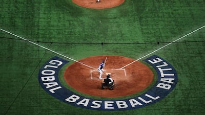 Japan's Takayuki Kishi pitches during the WBSC Premier 12 Super Round baseball match against South Korea, at the Tokyo Dome on Sunday, November 16. AFP