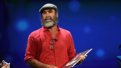 French former football star Eric Cantona receives the UEFA President's Award during the Champions League group stage draw at the Grimaldi Forum, in Monaco, Thursday, August 29, 2019. AP Photo/Daniel Cole