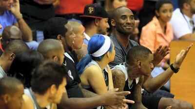 LA Lakers NBA player Kobe Bryant gestures as he coaches a team made up of United Arab Emirates celebrities at the American University of Dubai September, 27, 2013. AFP
