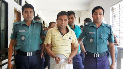 Bangladeshi police escort a man linked to the lynching of a 13-year-old boy in Sylhet, Bangladesh. AFP Phtoo