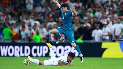 Bolivia's Fernando Nava, bottom, in action with Iraq's Zaid Ismail. Reuters