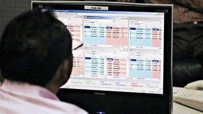 The value of equities traded by UAE brokerages declined 45 per cent to Dh57 billion last year, compared with the previous year. Jeff Topping / The National