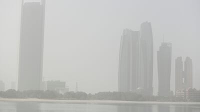 A sandstorm reduces visibility in the capital. Khushnum Bhandari / The National