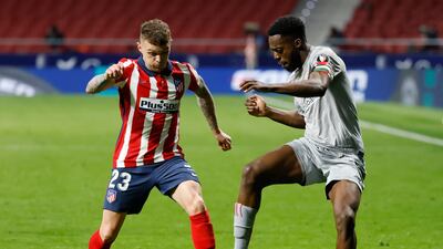 Atletico's Kieran Trippier attempts to tackle Inaki Williams of Athletic Bilbao in the La Liga match at Wanda Metropolitano Stadium on March 10. Reuters
