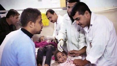 Young children are treated in the emergency room of the Al Shifa hospital in Gaza City after being wounded in an Israeli air strike