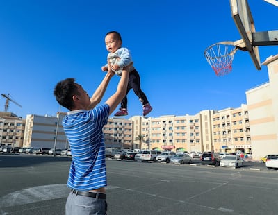 A resident of China cluster in Dubai’s International City. It’s the busiest and most popular section and the hub of Chinese life in the emirate. Victor Besa / The National