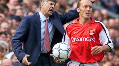 Arsene Wenger behind Arsenal defender Lee Dixon during the Premier League game at Bradford City on September 4, 2020. Allsport