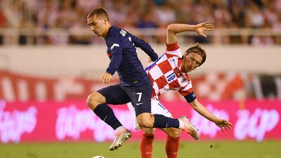 Antoine Griezmann of France is challenged by Luka Modric of Croatia. Getty Images