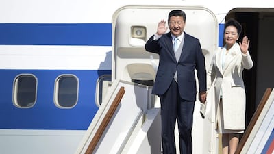 Chinese President Xi Jinping with his wife Peng Liyuan at Moscow's Vnukovo II airport in May. AFP