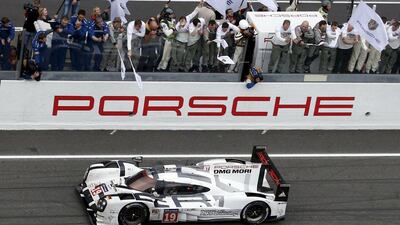 Nico Hulkenberg of Germany celebrates with mechanics after winning with the Porsche 919 Hybrid No 19 the Le Mans 24-hour race in central France on June 14, 2015. Hulkenberg ws partnered Nick Tandy of Britain and Earl Bamber of New Zeland. Regis Duvignau / Reuters
