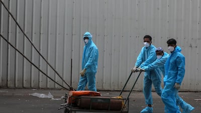 Health workers start their shift to attend to Covid-19 positive patients at jumbo Covid-19 centre in Mumbai. EPA