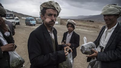 Yemeni men selling qat on the highway between Amran and Hajja governorates, both areas dominated by Houthi rebels, northern Yemen. Qat is a green leaf from a plant that is chewed on and used as a mild stimulant. Asmaa Waguih/EPA