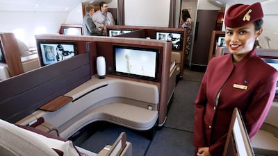 A Qatar Airways crew member presents the first class seats of an Airbus A380 aircraft during the 51st Paris Air Show at Le Bourget airport near Paris on June 17, 2015. Pascal Rossignol / Reuters