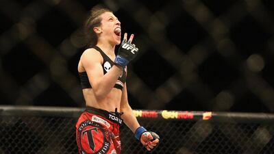Joanna Jedrzejczyk celebrates after winning the women's strawweight title from Carla Esparza at UFC 185 on Saturday night. Ronald Martinez / Getty Images / AFP