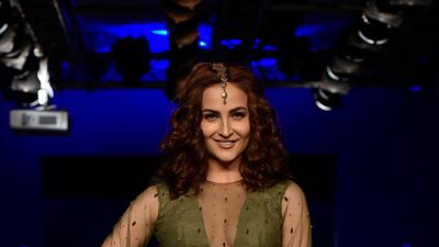 Actress Elli Avram showcases a creation by designer Ekta. AFP